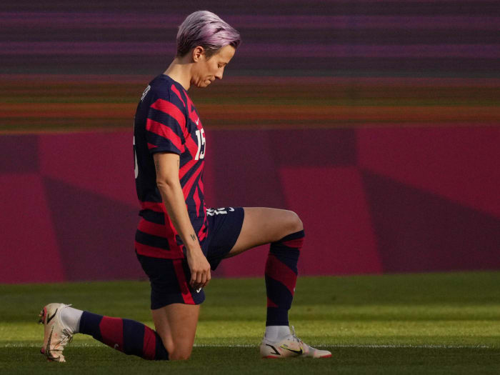 United States forward Megan Rapinoe kneels before the bronze medal match against Australia during the Tokyo 2020 Olympic Summer Games.